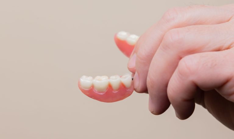 how to clean dentures, false teeth implants
