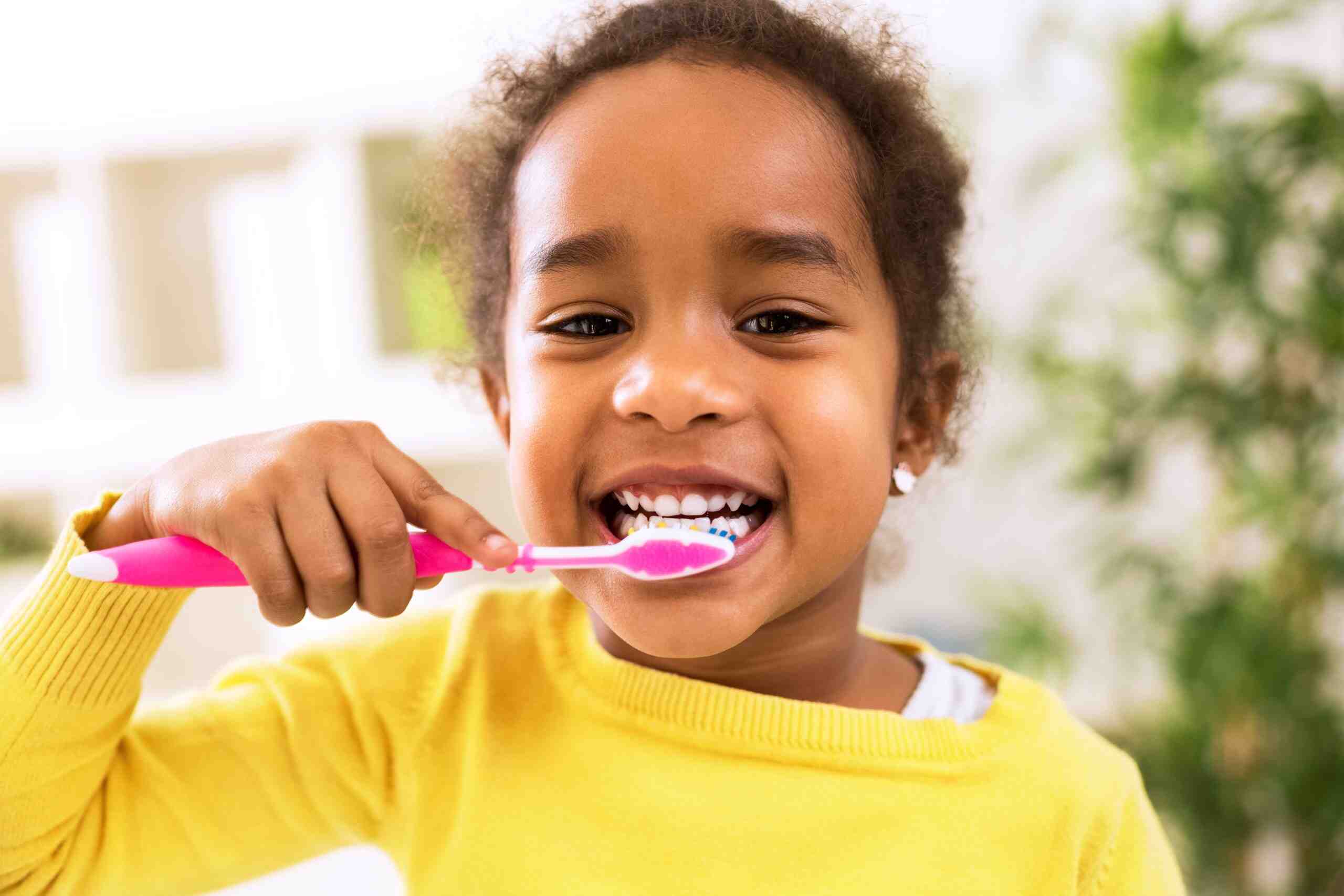 protect kids teeth by brushing teeth